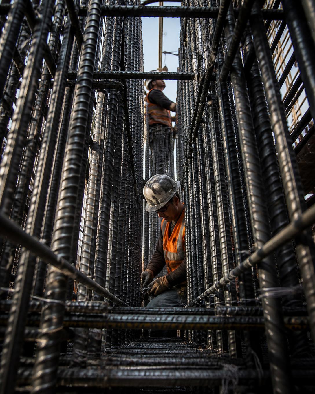 Ironworkers installing a reinforcing steel cage
